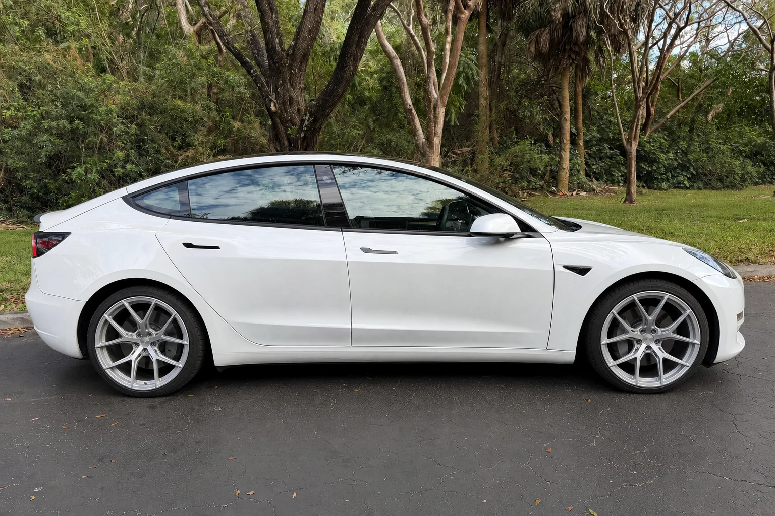 Virtual wheel try-on with satin silver wheels on an electric sedan